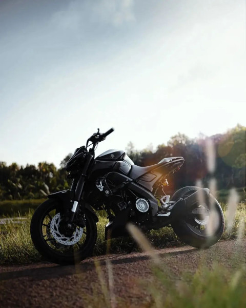 Royal Black Motorcycle in Stand With Nature Sky and Cool Background